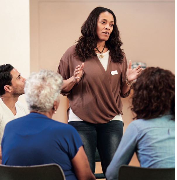 Image of a woman speaking to a group